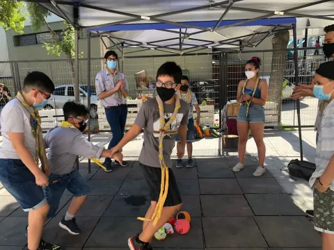 Scouts play during a Migrant Scout meeting in Chile