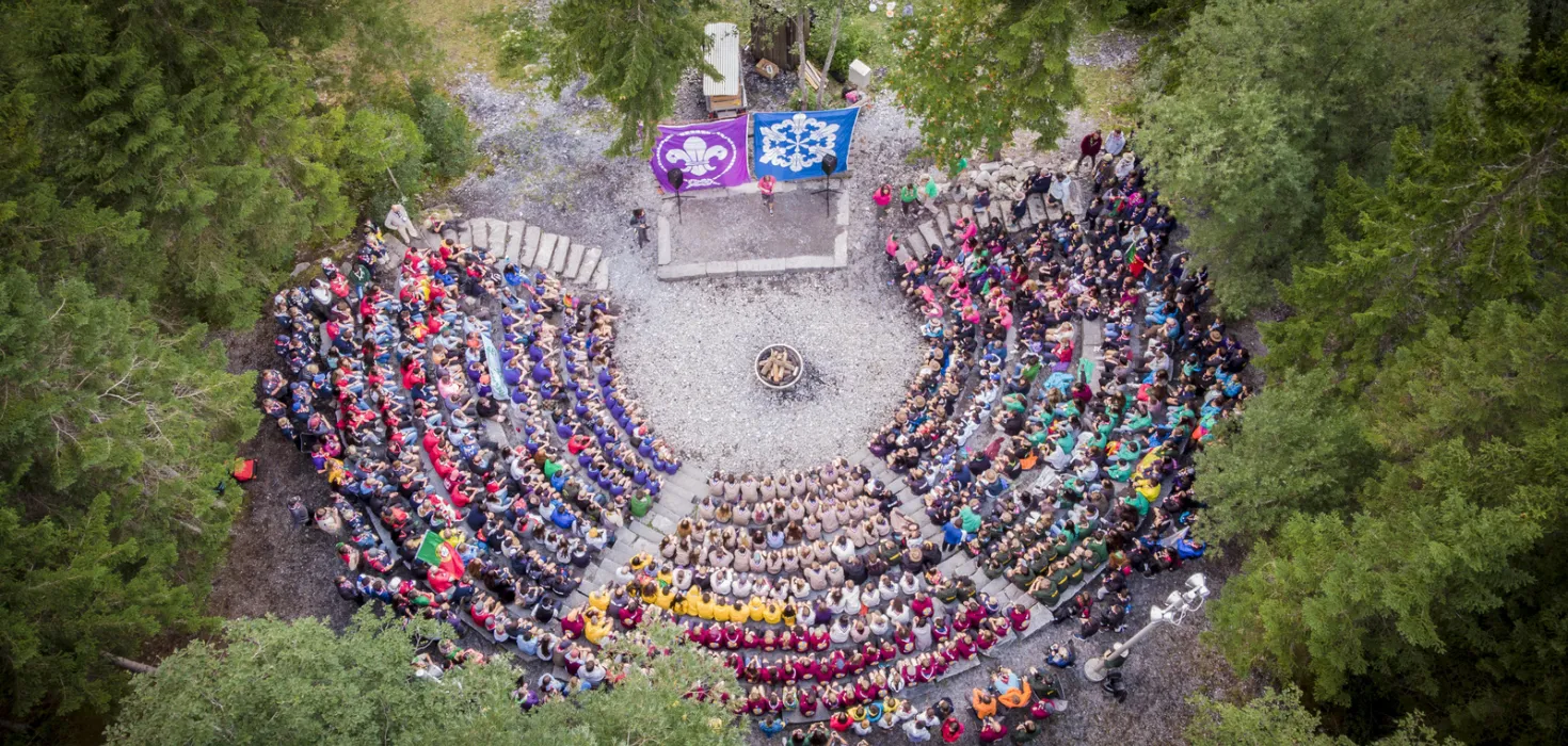 Aerial photo of hundreds of Scouts at an international Campfire at Kandersteg International Scout Centre (KISC) in Switzerland