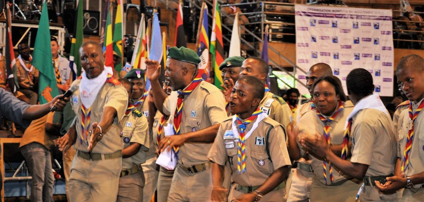 Scouts from africa dancing in uniform