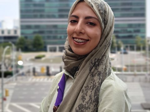 Scout Nadine Shili poses in front of the United Nations headquarters in New York City