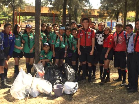 Scouts in Mexico pose in front of their clean up efforts