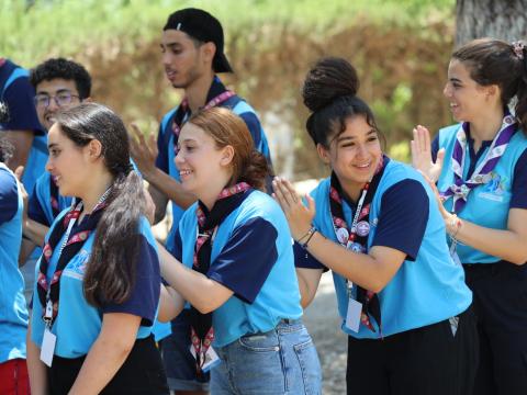 Scouts play a game in a line during the Arab Scout Moot