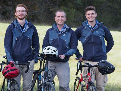 Pierre, Antonin and Florian stand next to their bikes.