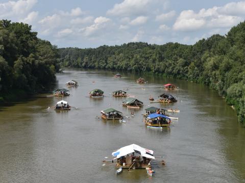 Rafts navigating in a river.