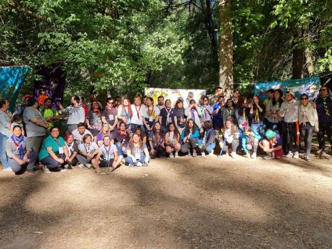 A group of happy Scouts from Chile helping in their community.