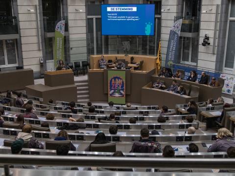 Young people sit at the Flemish Parliament.