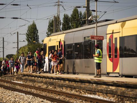 Scouts walk towards a train in Portugal.