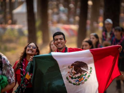 Scouts from Mexico waving their flag