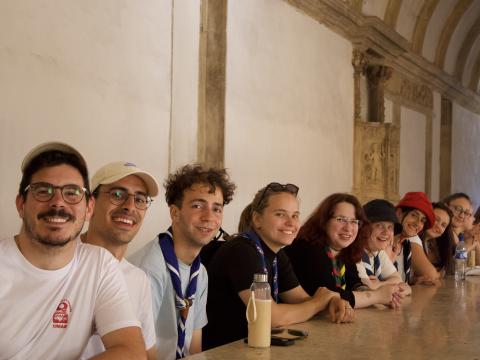Participants from the training sit around a table at a UNESCO heritage building.