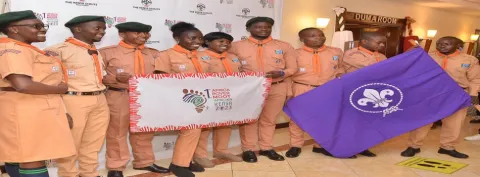 scouts holding the flag of the new moot logo