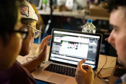 Scouts look at a laptop together