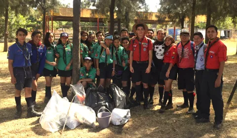Scouts in Mexico pose in front of their clean up efforts