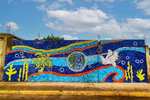 The final mural is eye-catching, helping bring a spirit of action to protect the environment in a community near the ocean.