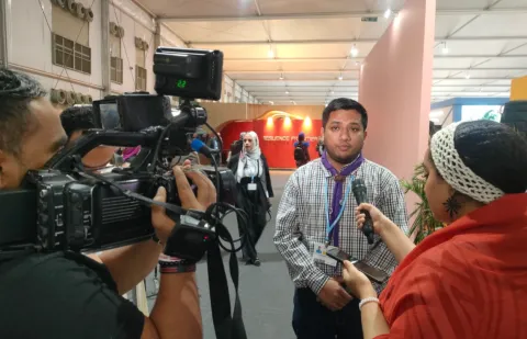 Kazi Zubair Hossain, WOSM Youth Representative, speaks to reporters at COP27 in Egypt