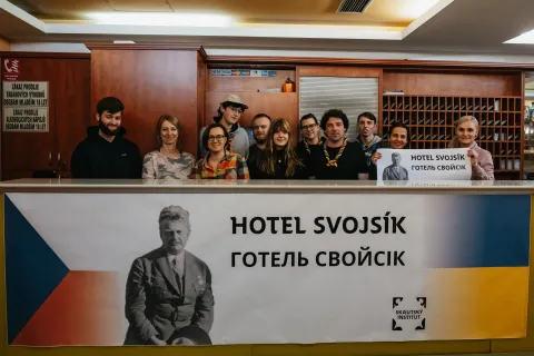 Volunteers and staff behind the hotel reception.