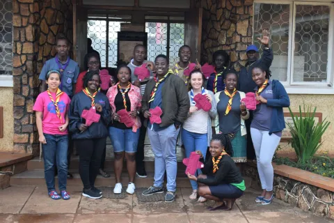 The partnership meets in Uganda and teaches a group how to sew menstrual pads in schools and communities.