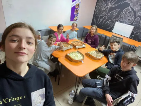 Anna takes a selfie with Ukranian children at their Scout centre.