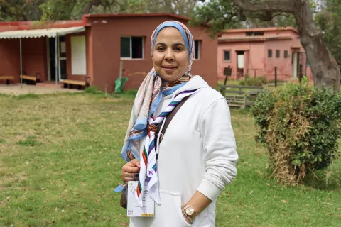 Shayma, an Arab Youth Advisor and volunteer, stands at the Arab Parajamboree