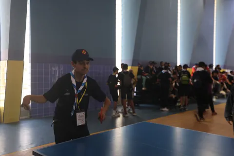 A Scout named Amine plays games during the Arab Parajamboree