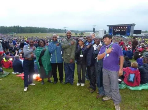 Jonathan Omondi from Kenya was part of the WOSM team at the World Scout Jamboree in Sweden in 2011, pictured here in front of the main stage with Scouting friends.