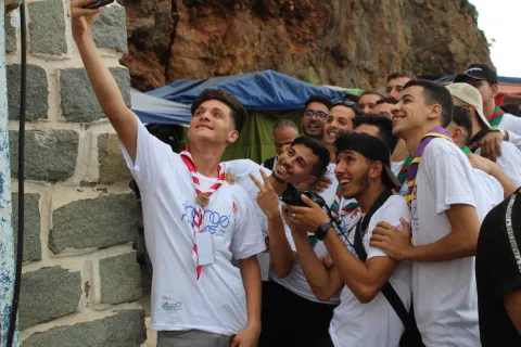 Happy Algerian Scout youth taking a selfie