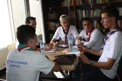 Algerian youth Scout gathering on a desk