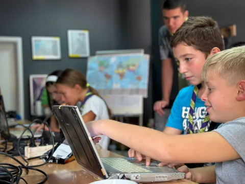 Serbian Scouts check out JOTA-JOTI 2023 activities on a laptop