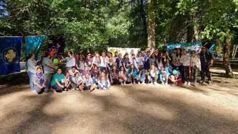 A group of happy Scouts from Chile helping in their community.