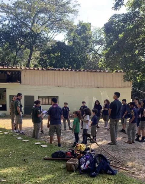 Scouts stand outside while working on their Plastic Tide Turners project