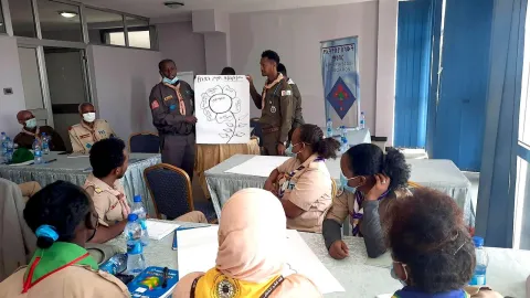 Participants make a presentation from group discussions during a gender equality training