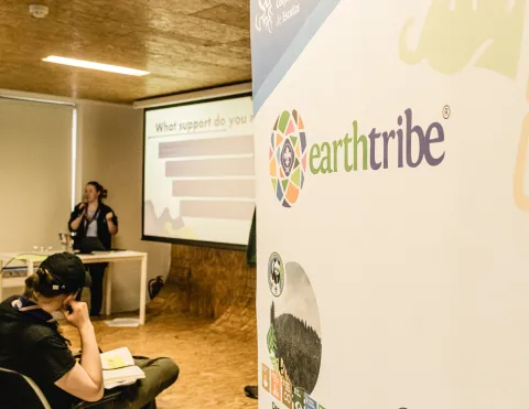 Earth Tribe logo in a banner
