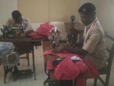 A group of Togolese Scouts collaborate in an agricultural activity, united in the effort to cultivate their land. They set a fine example of teamwork and community dedication, in harmony with the natural world around them.