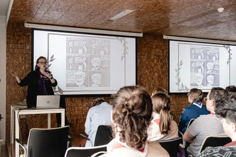 Maire presents in front of a group of Rovers during the Agora 2023.