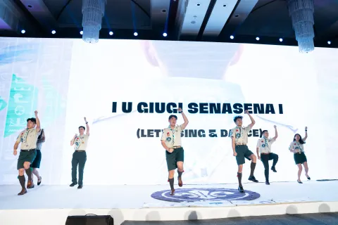 Scouts of China dance during their bid presentation.