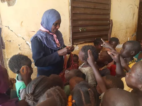 Scouts with children in Sudan