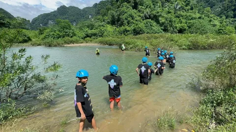 Scouts Viet Nam walking through rivers for JOTA-JOTI