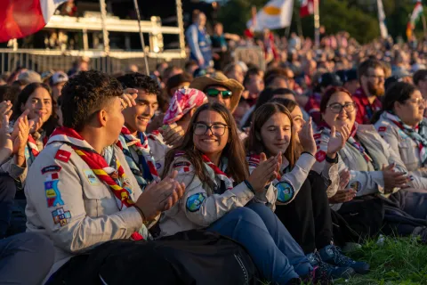 The Maltese contingent claps during the opening campfire.