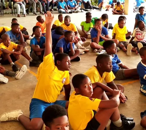 Scout from Bahamas raising hand