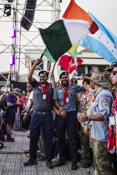 Scouts waving flags at the Moot