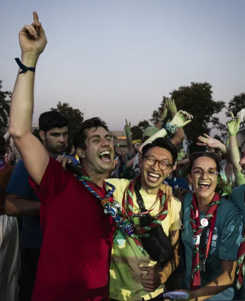 Scouts cheer at the closing ceremony of the 16th World Scout Moot