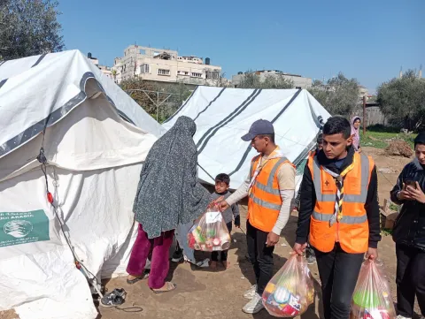 Scouts carry bags in Palestine