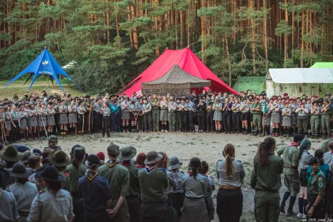 Participants stand in a circle waiting to light the fire of Watra.