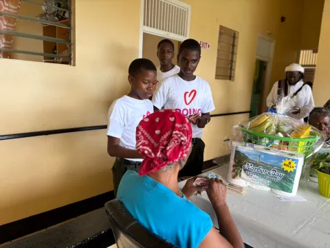 Greanada scouts talking with elder people