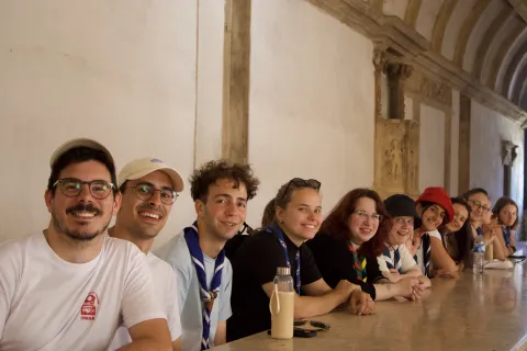 Participants from the training sit around a table at a UNESCO heritage building.