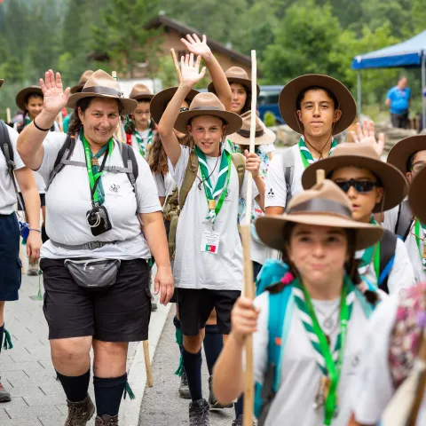 Scouts walking and waving