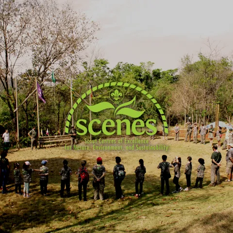 scouts gathering in a cricle in a camp