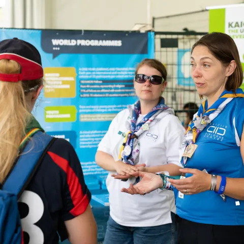 scouts talking to an external partner
