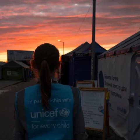A Polish Scout wears the UNICEF blue vest.