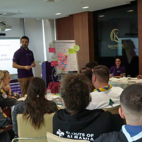 Adults in Scouting listen to a presentation.